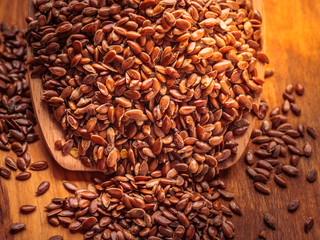 Flax seeds linseed on wooden spoon