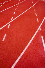 Red running track Synthetic rubber on the athletic stadium.
