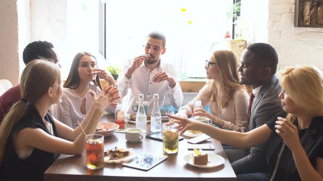 Group of Young Mixed race People in Coffee Shop.