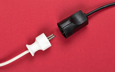 Disconnected white european power cable plug with black connector cable