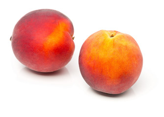 Fototapeta na wymiar Two uncut, whole, ripe peaches fruit