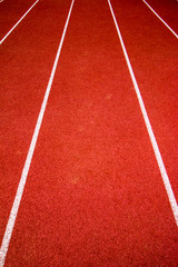Fototapeta premium Red running track Synthetic rubber on the athletic stadium.