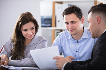 Advisor Discussing With Couple