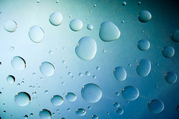 Water Drops On Blue Background.