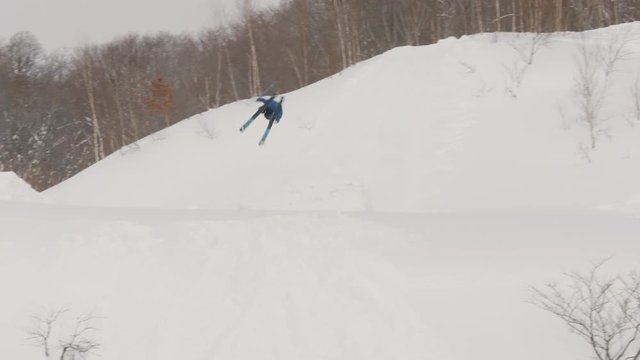 Ski Skier Crash into Tree Off Jump Tumble Flip Over Powder in Slow Motion