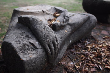 A destructed statue of buddha in Ayutthaya