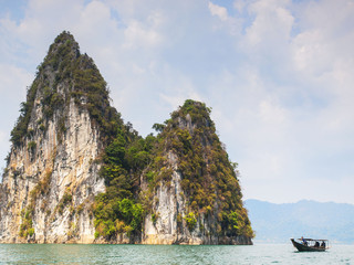 Obraz premium Karst limestone rock outcrops in the ocean, Khao Sok National Park, Thailand