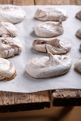 Fototapeta na wymiar Homemade marble chocolate meringue cookies on a baking sheet