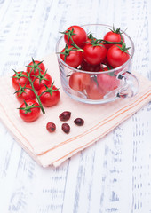Beautiful ripe tomatoes in a transparent circle. Healthy food. Vegetable diet. Wooden board rustic