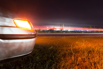 Auto near highway at night