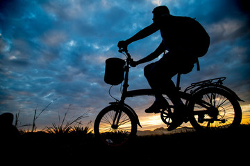 Asian man ride bicycle