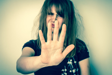 Woman is showing stop gesture with her hand