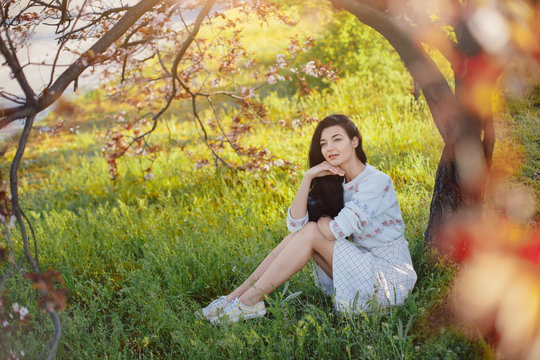 Woman in park. Pleasure of spring nature.