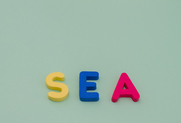 The word sea is from colored letters on a light green background