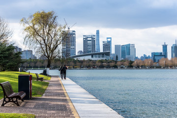 Fototapeta premium City Skyline By River Against Sky in city of China.