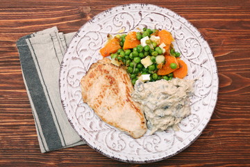 Turkey fillet with mushrooms in cream sauce and vegetables