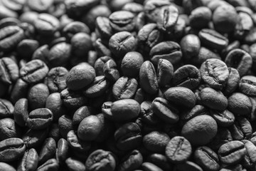 Roasted coffee beans on dark background. Selective focus.