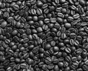 Roasted coffee beans on dark background. Selective focus.