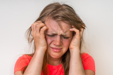 Portrait of a crying woman with bruised skin and black eyes