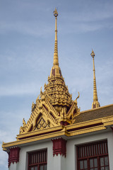 Fototapeta premium Loha Prasat Wat Ratchanatdaram in Bangkok Thailand which means iron castle or monastery is composes of five towers, of which the outer, middle and the center tower contain large black iron spires. 