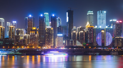 City Skyline By River Against Sky at night in city of China.