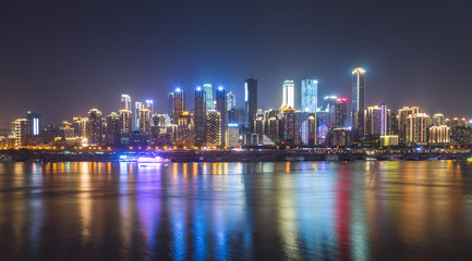 Fototapeta na wymiar City Skyline By River Against Sky at night in city of China.