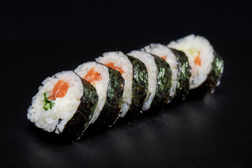 Sushi on black background. Perfect for creating sushi restaurant menu. Part of series.