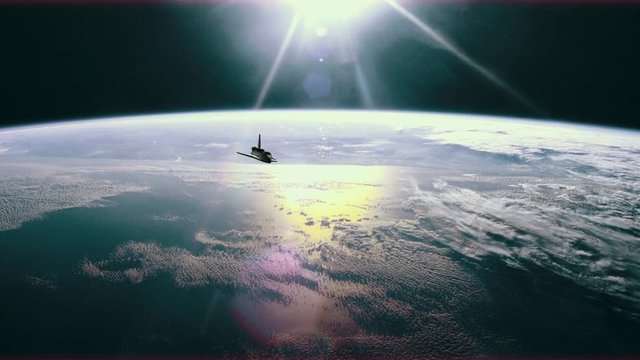 Space shuttle in orbit around planet Earth.