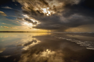Storm reflected on the beach