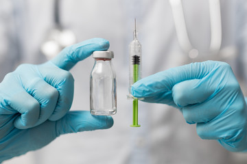 Syringe, medical injection in hand. Vaccination equipment.