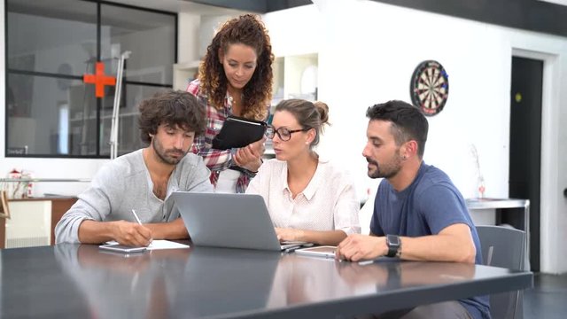 Young people meeting with laptop computer