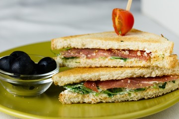 Sandwich with cheese and basil spread and carpaccio