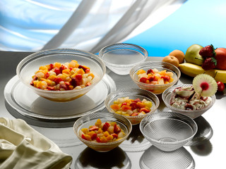 fruit salad and ice-cream served i glass bowls