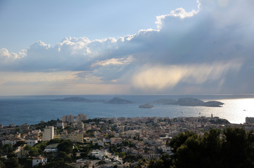 Seascape. Storm cloud over the city by the sea.