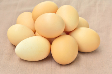 Stacked Egg On brown sack background.