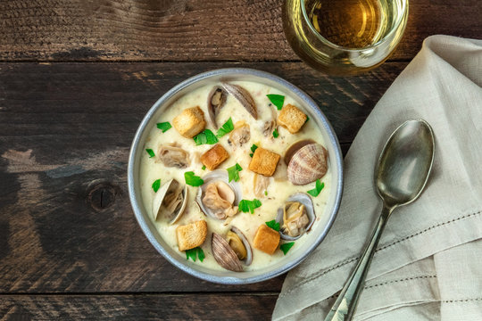 Bowl of clam chowder soup, overhead shot, with copy space