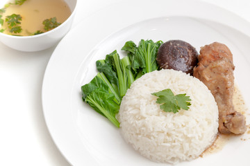 Rice with chicken drumstick served with soup