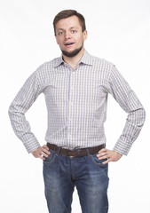 Young happy man portrait of a confident businessman showing presentation, pointing paper placard gray background. Ideal for banners, registration forms, presentation, landings, presenting concept.