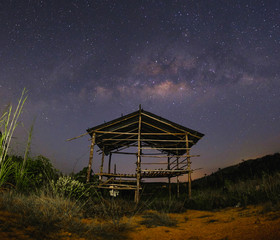 Milkyway over the outdated hut  in the early of night at Muadzam Shah, Pahang, Malaysia ( Visible...