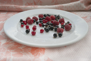 Raspberry black currant on a plate