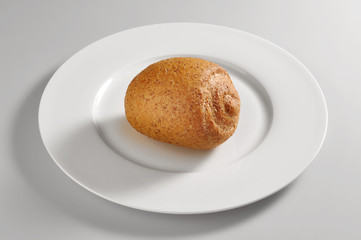 Round dish with bread made with whole wheat