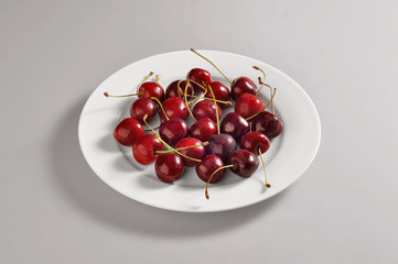 Round dish with cherries portion
