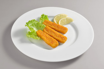 Round dish with fillet fish sticks breaded and fried