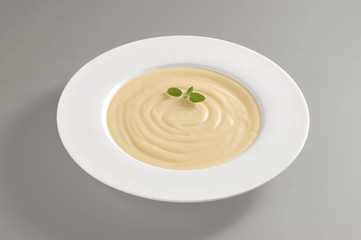 Round dish with potato pureed soup