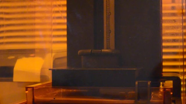 Print 3D printer detail of photopolymer general view, close. Stereolithography 3D printer, modern and progressive additive manufacturing technology of liquid photopolymerization under UV light