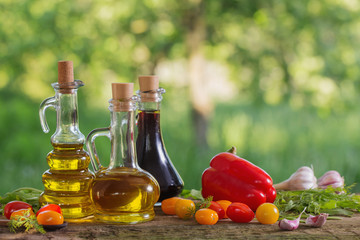 vegetables with oil on wooden table outdoor
