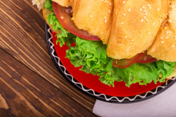 Croissant sandwich on a saucer