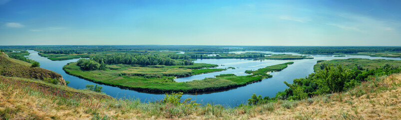 Summer colorful landscape on delta of the river Vorskla from the hill.