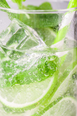 Fototapeta na wymiar Detox water with lime and mint in glass