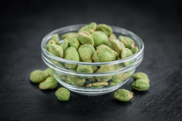 Portion of Wasabi coated Peanuts (selective focus)